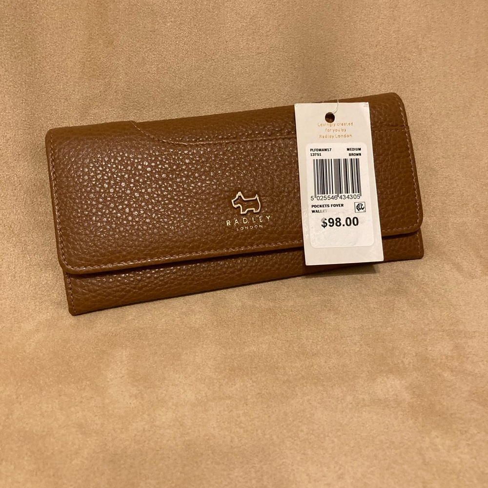 NWT Radley London wallet with many compartments.  All leather in pristine shape
